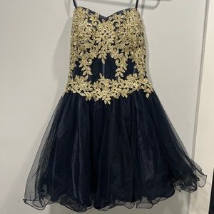 This is a short/mid length dress with gold embroidery and a navy blue body.